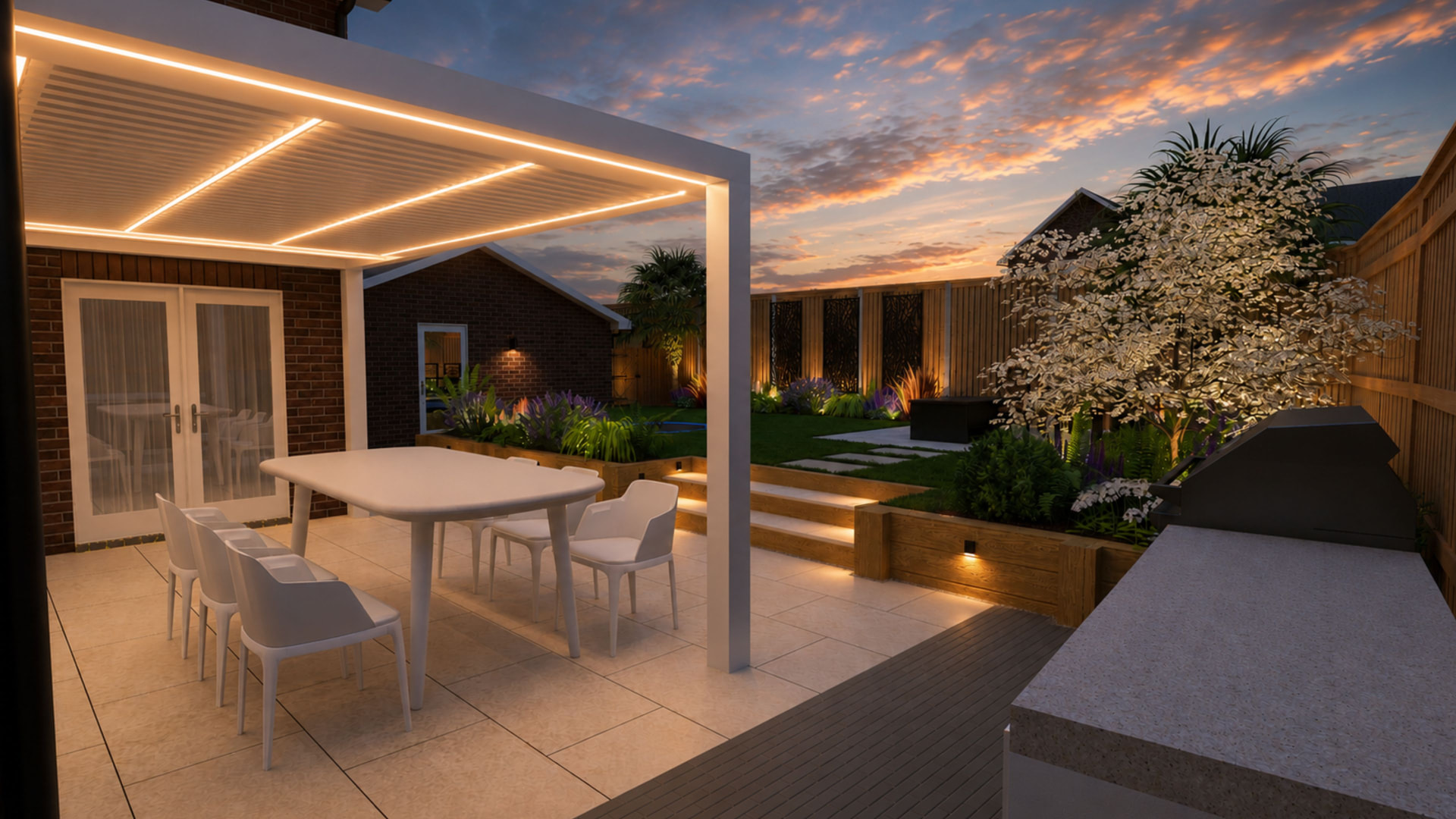 Garden design at dusk with an illuminated louvred pergola, dining terrace, patio steps and uplit tree