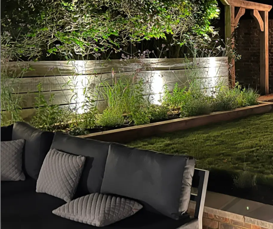 Fresh Air Landscapes garden design showing layered outdoor lighting after dark