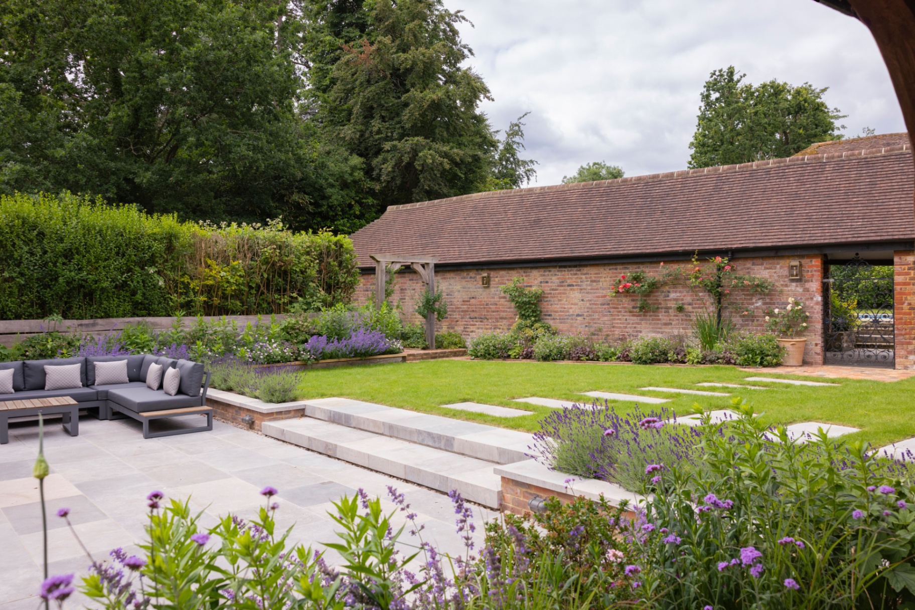 Bespoke garden room at twilight with seating area and reflection pool