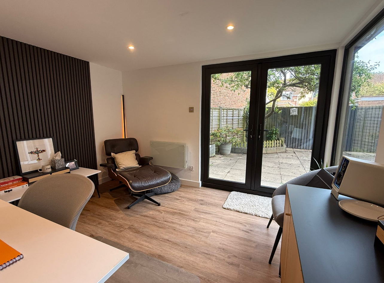 Garden room interior showing bifold doors and heating