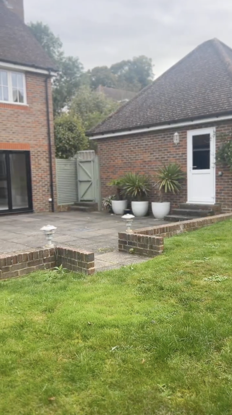 Original Dell garden - side path with planters and gated access
