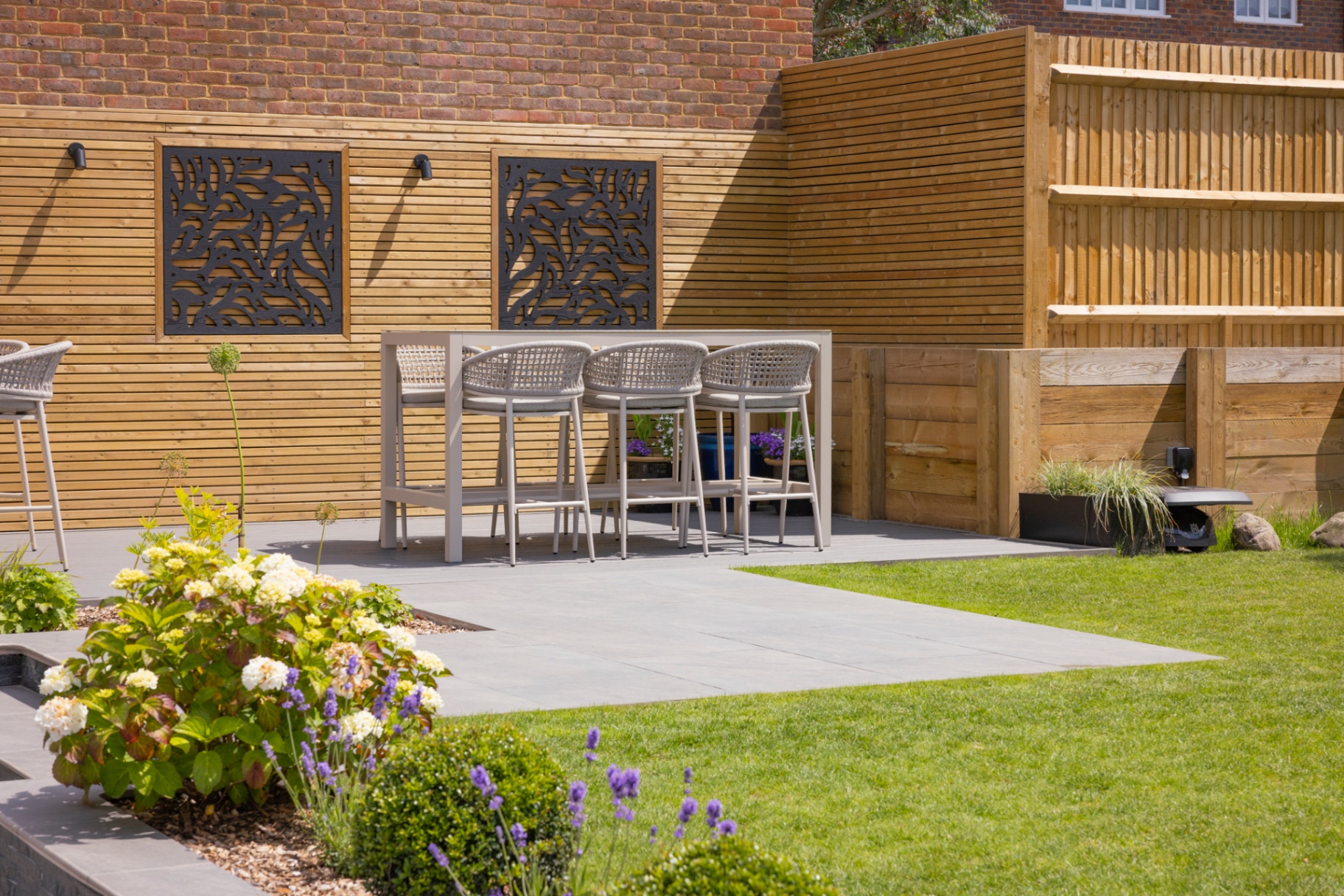 Completed hillside garden with terraces and mixed planting