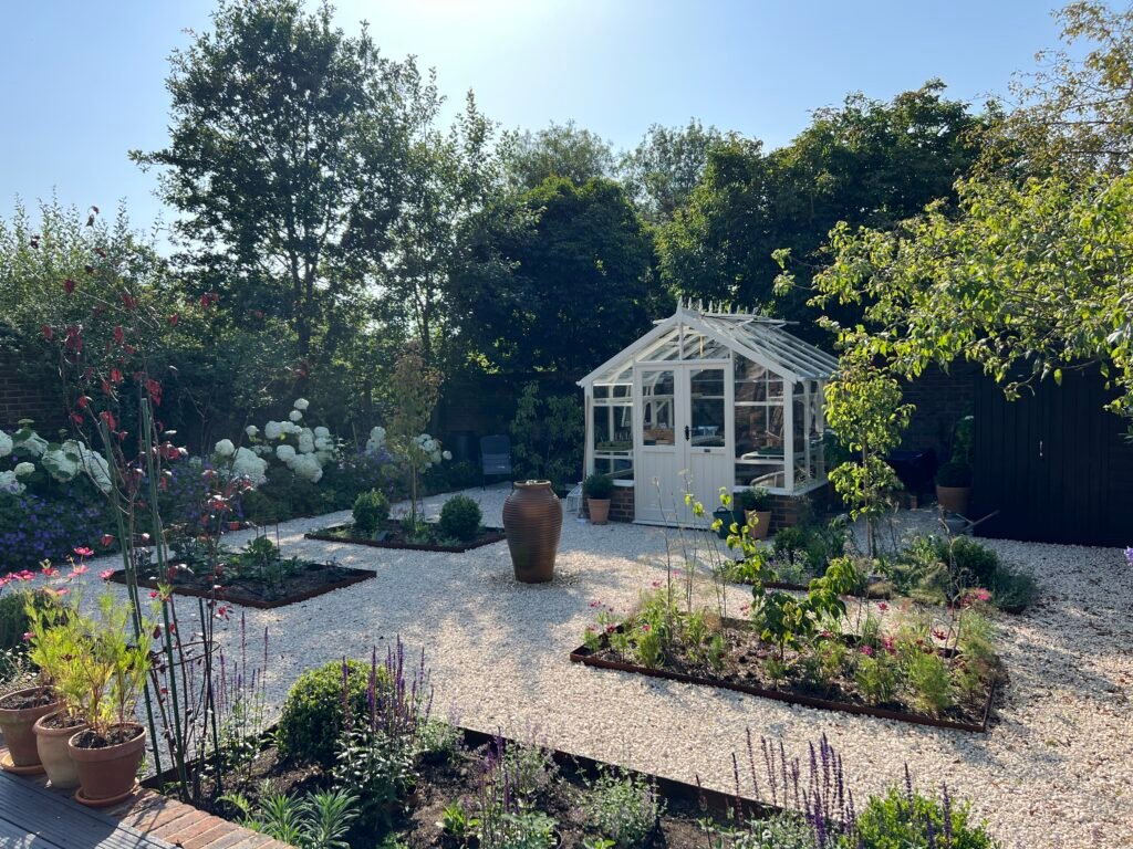 Sustainable garden with a white garden room